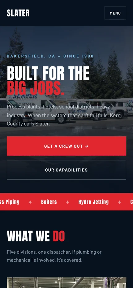The Heavy Industry homepage on a phone with a Menu button, the Built for the big jobs headline, stacked Get a crew out and Our capabilities buttons, and the red ticker