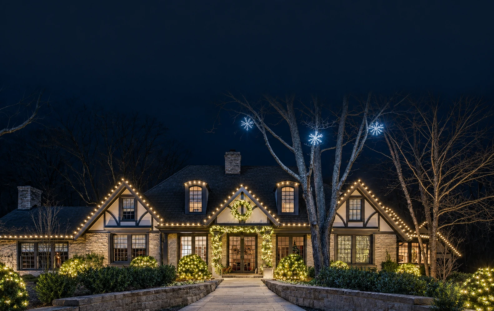 A house illuminated with warm white Christmas lights, from the supplied Light Ops marketing imagery