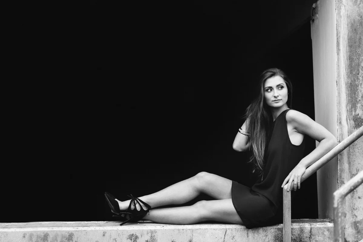 Black-and-white editorial senior portrait downtown