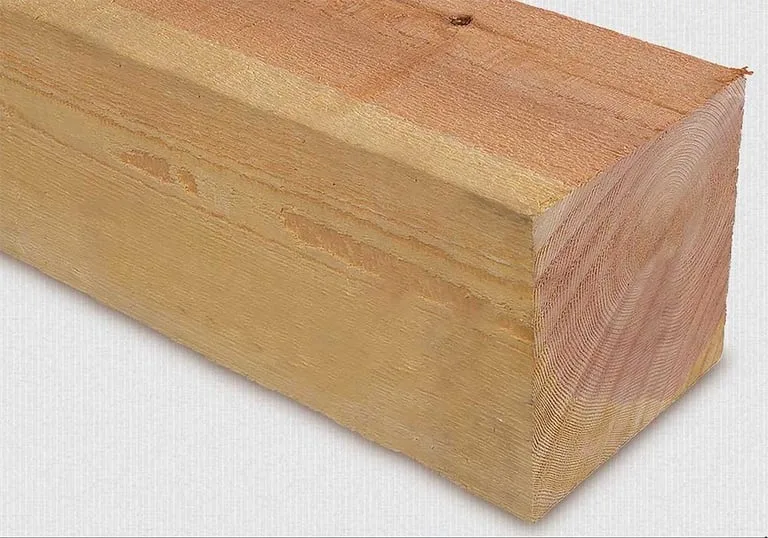 Rough sawn cedar timbers stacked in the yard