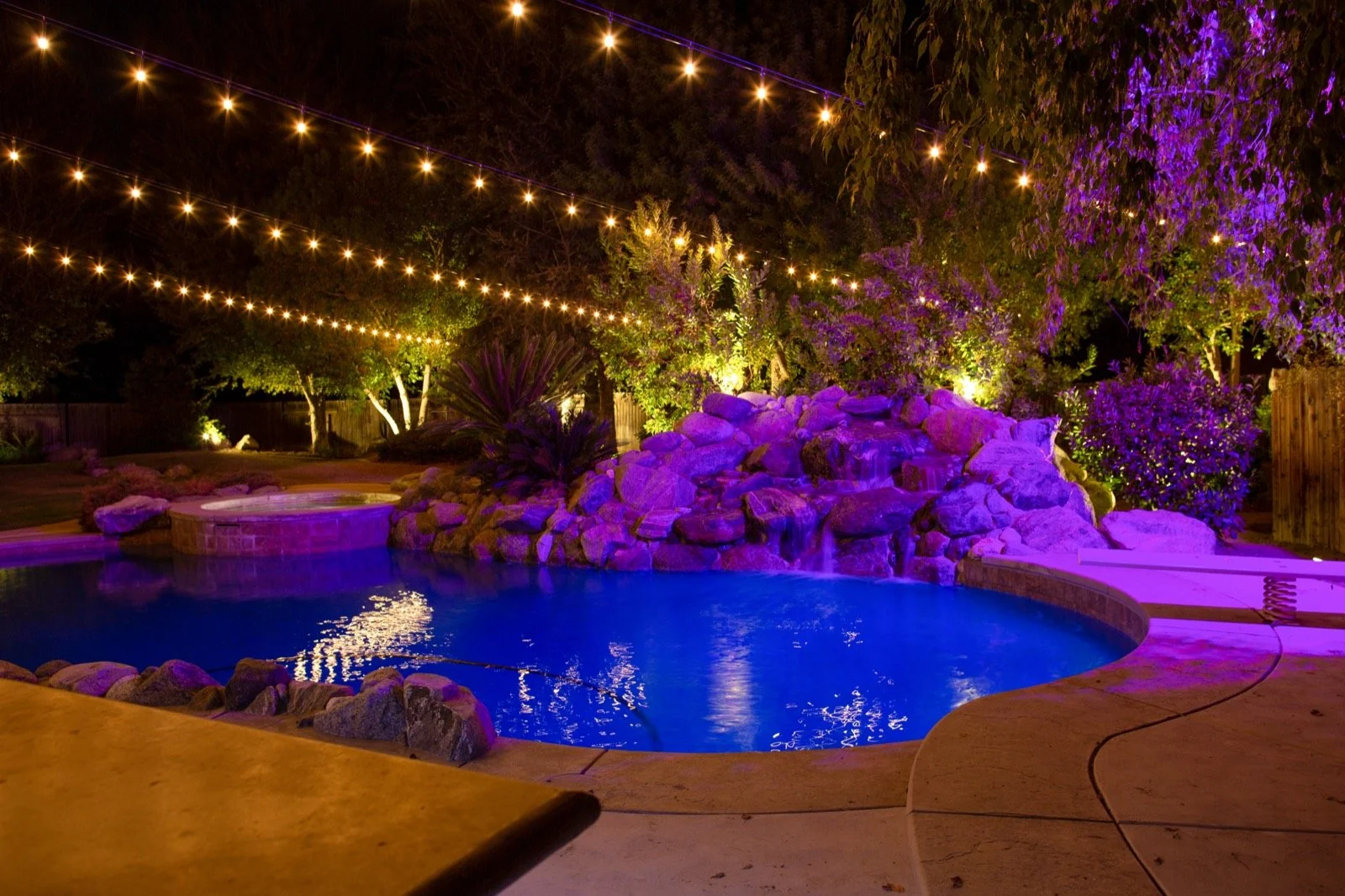 Landscape and string lighting around a Bakersfield pool
