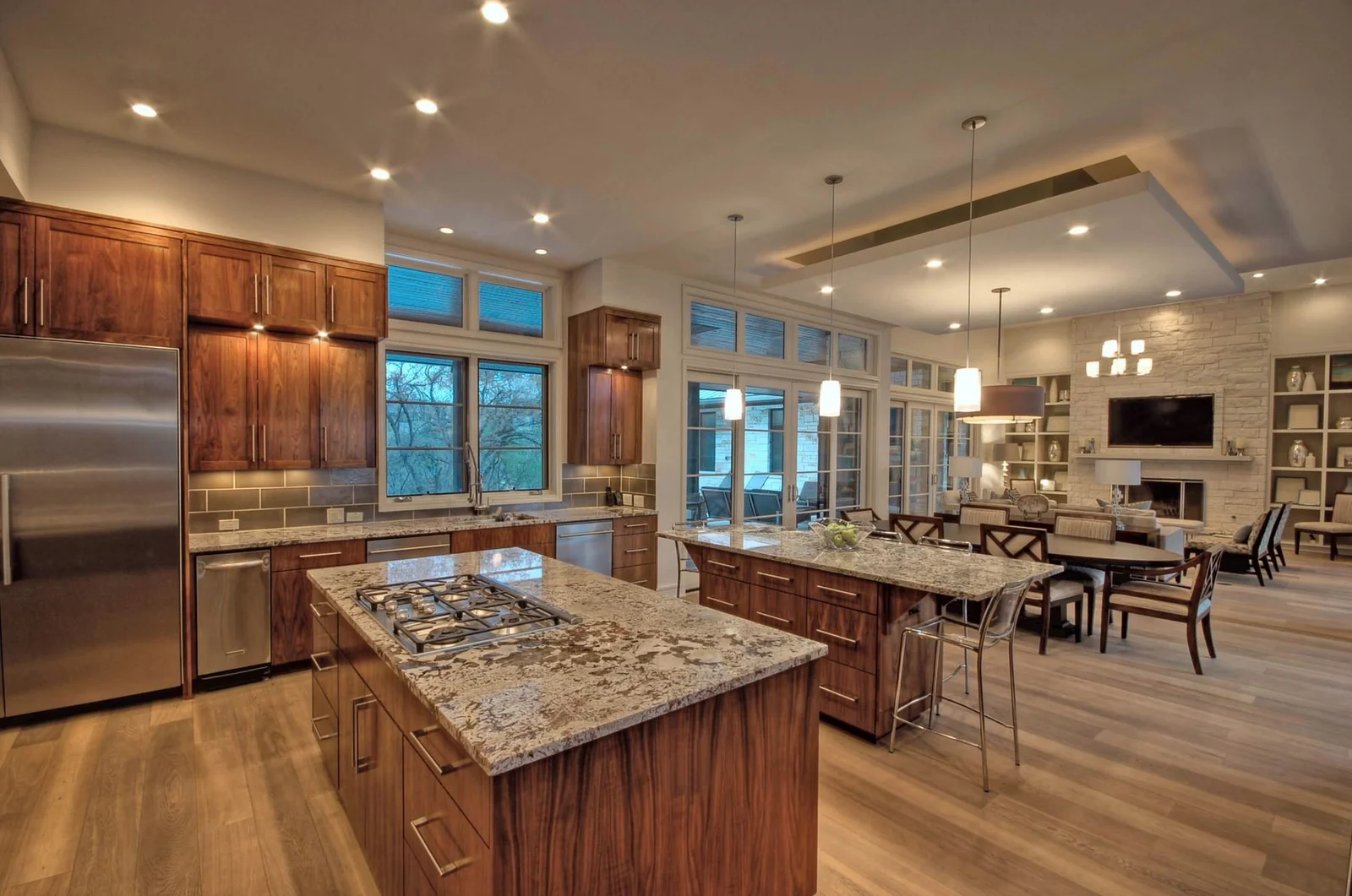 Warm interior ceiling, pendant, and under-cabinet lighting