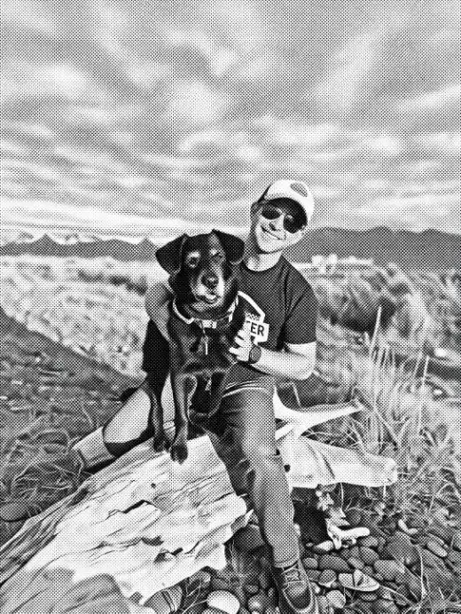 Nathan Staker outdoors with his dog