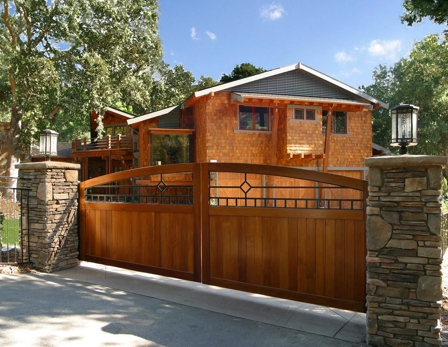 Custom cedar driveway gate at a craftsman residence