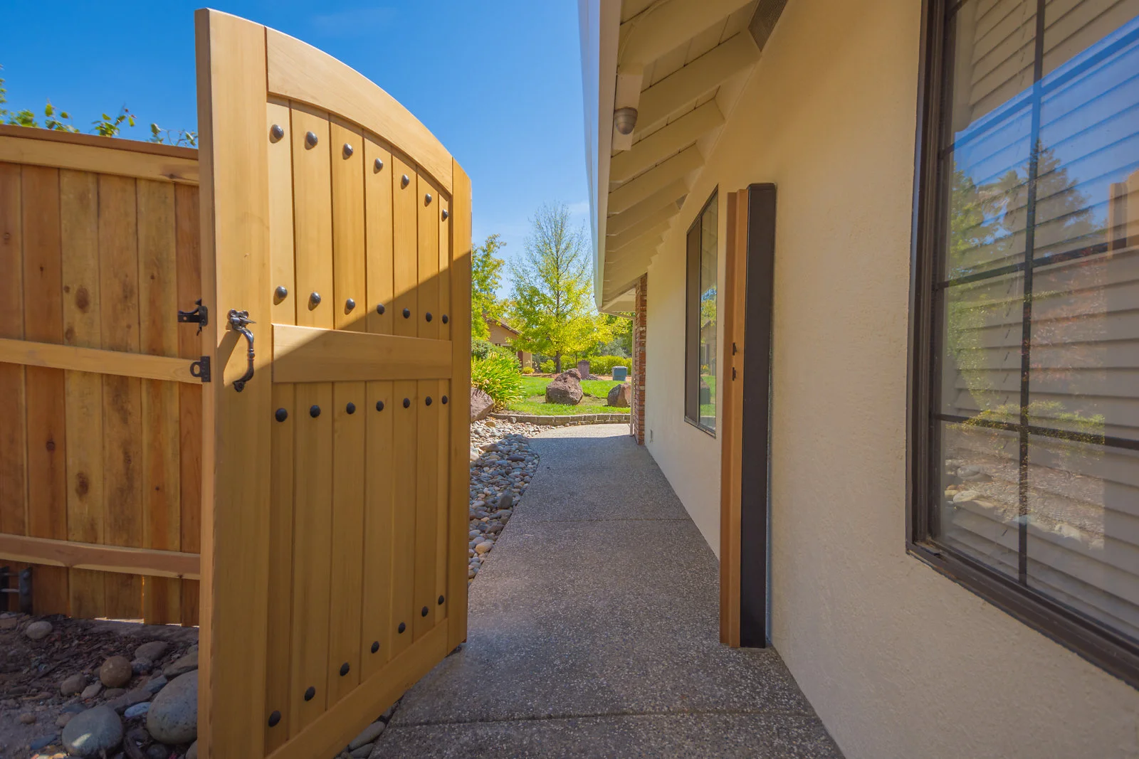 Clear cedar gate with traditional iron details